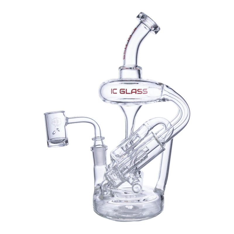 A clear glass water pipe with a curved neck, internal chamber, and a separate glass bowl attachment, branded with 'IC GLASS' in red text on the main body, shown against a plain white background.