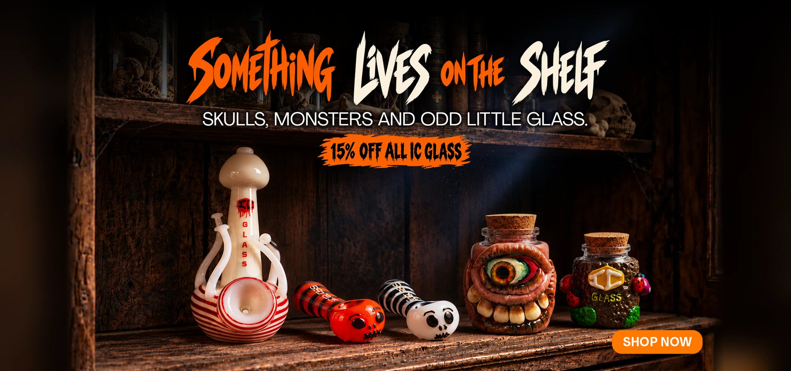 Something lives on the shelf: skulls, monsters and odd little glass, 15% off all IC Glass. IC Glass pipes and monster stash jars on an old wooden shelf.