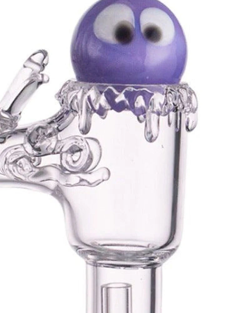 Googly eye carb cap sitting on the dripping rim of the Luminous B banger